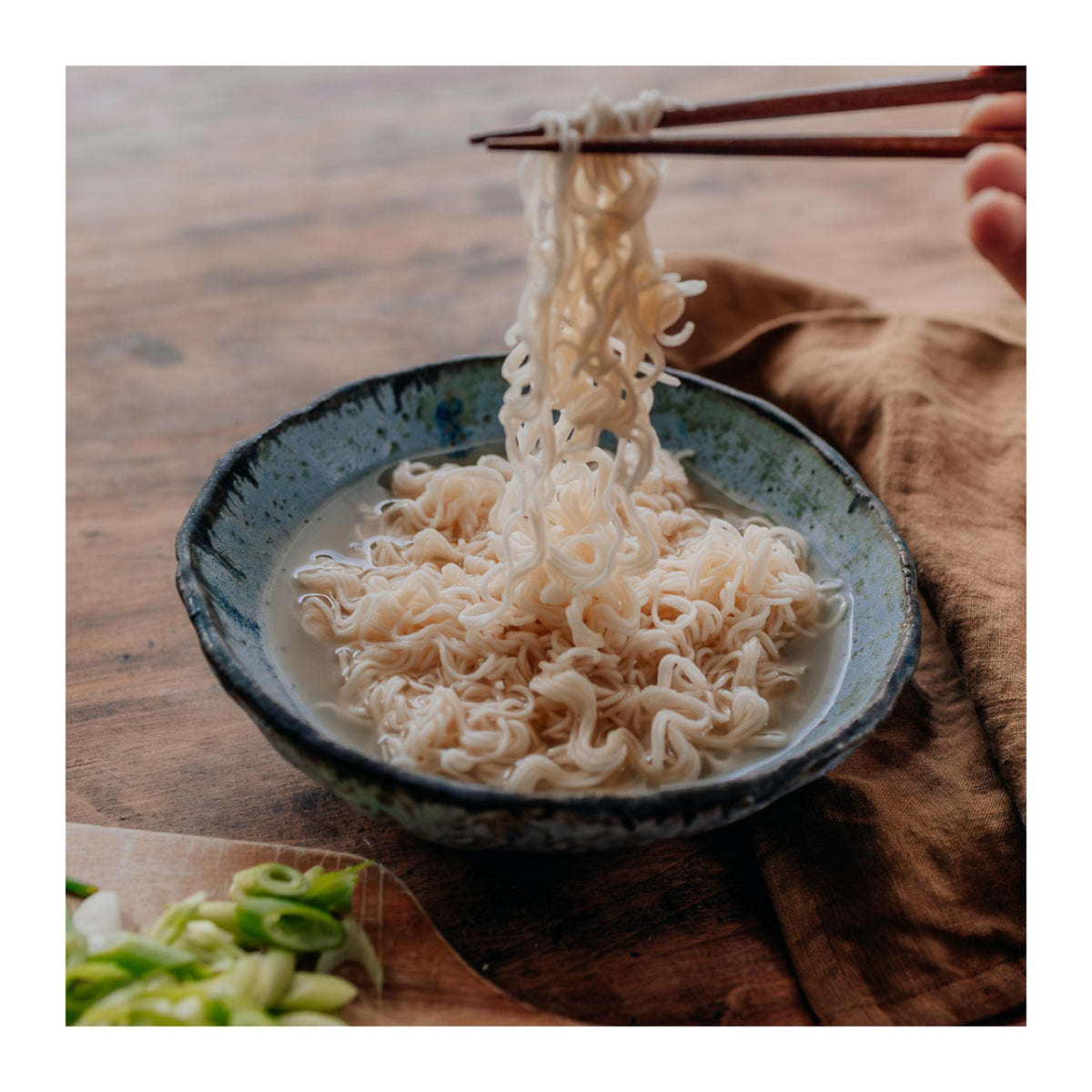 Ceres Organics instant noodles prepared in a bowl with chopsticks