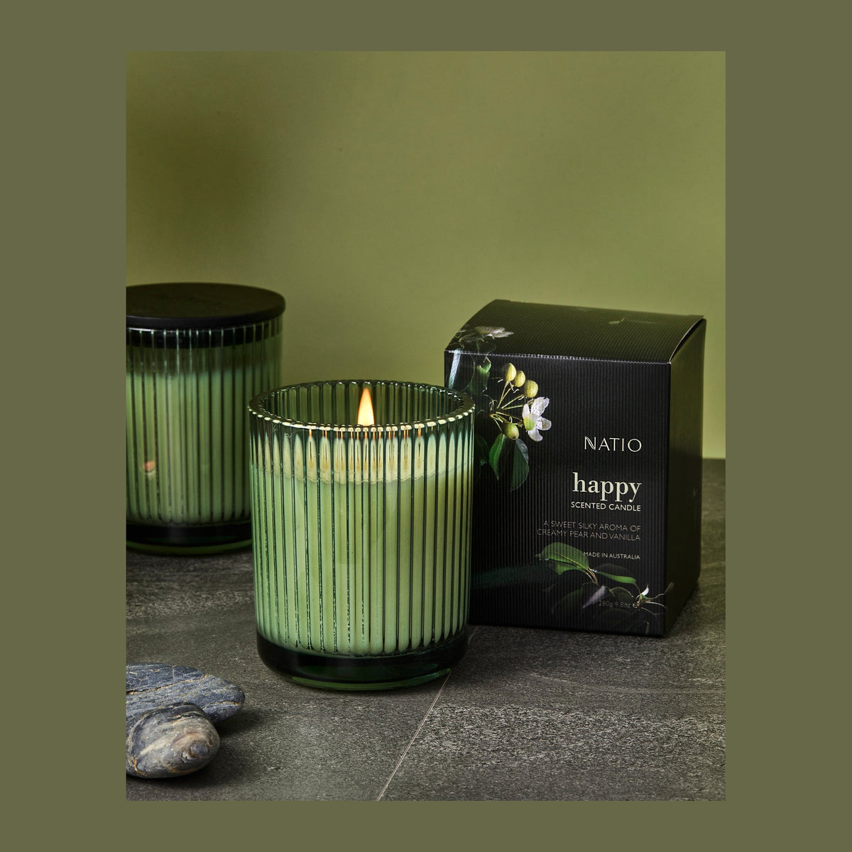 Natio Happy Scented Candle 280g styled in a set photograph
