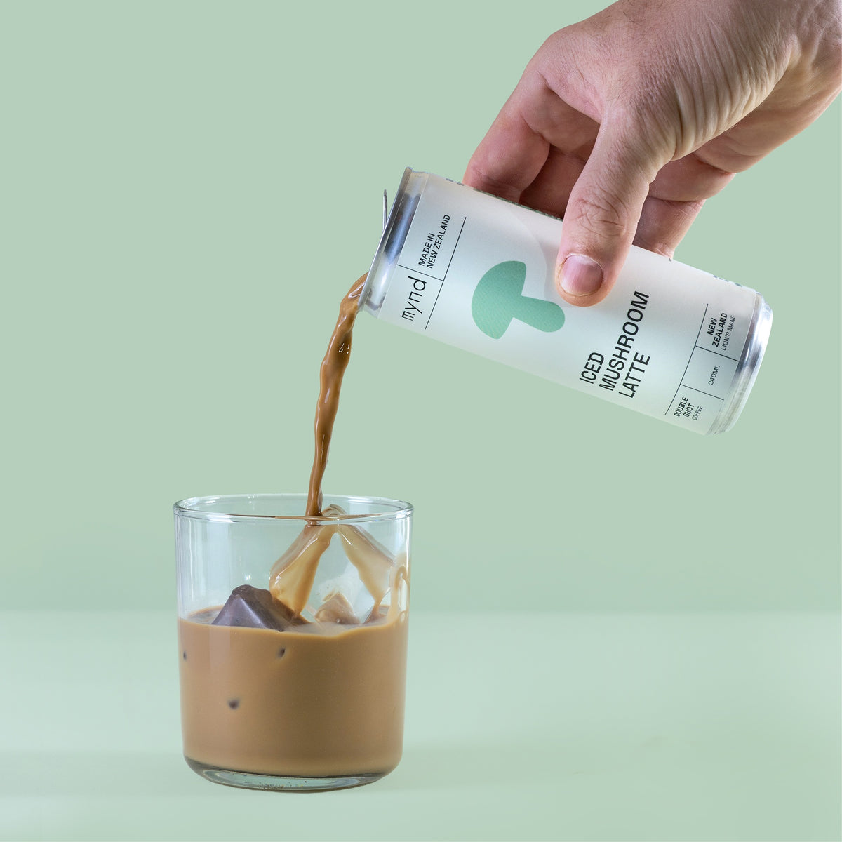 Mynd Iced Mushroom Latte being poured over ice