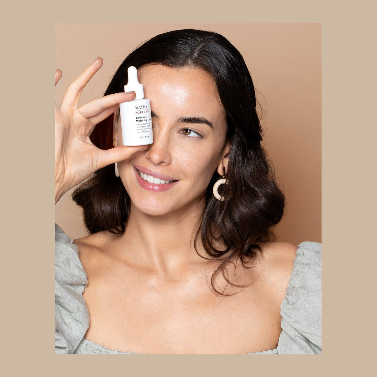 Natio Ageless Lum. Perf. Serum 30ml shown in use