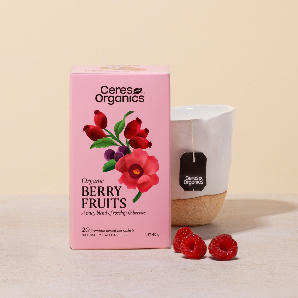 Ceres Organics Berry Fruits Herbal Tea box beside a cup