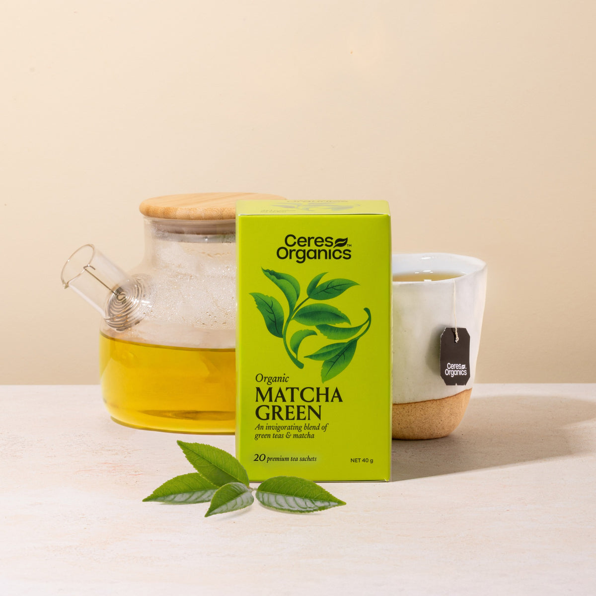 Ceres Organics Matcha Green Tea box beside a glass teapot