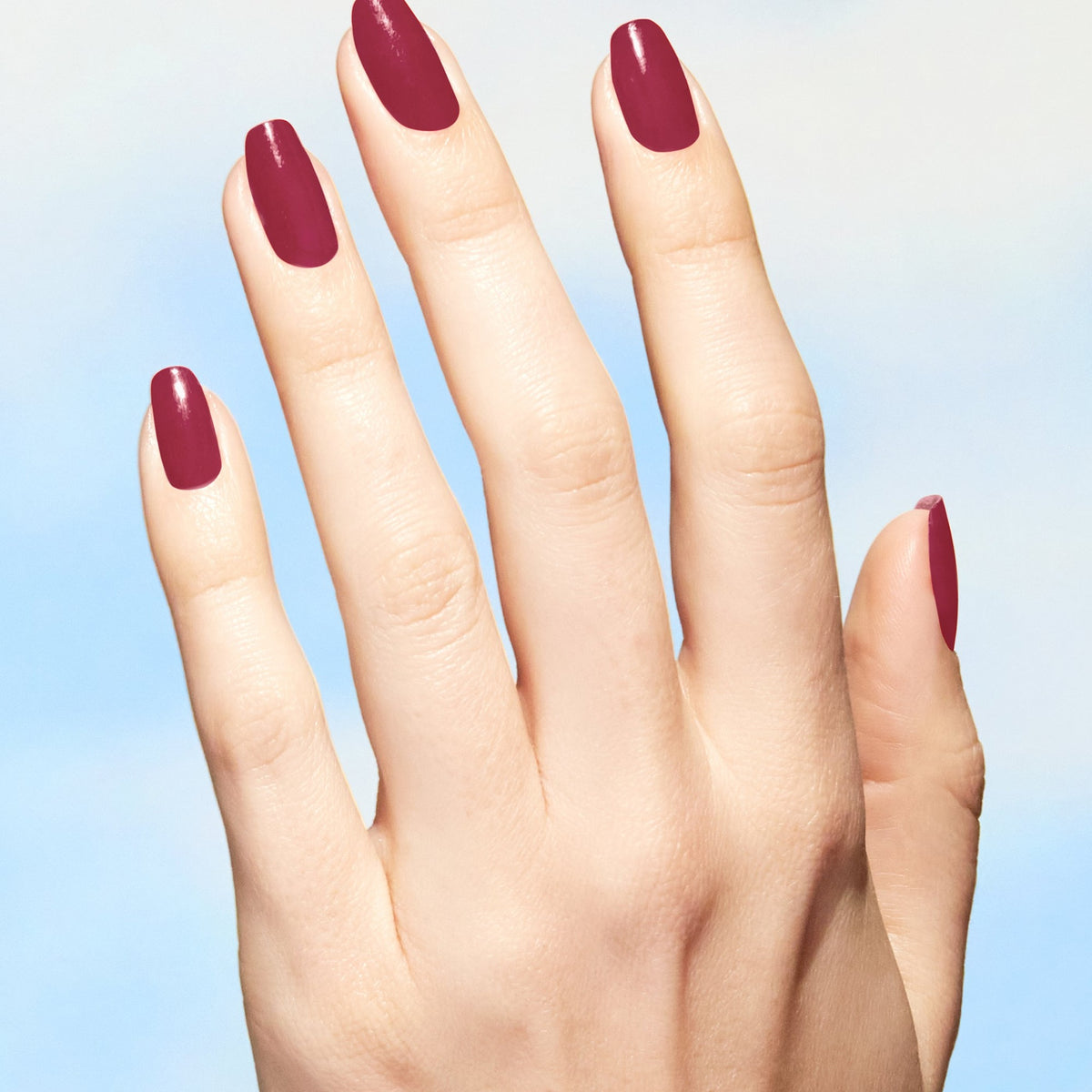 A manicure painted in OPI Give a Garnet