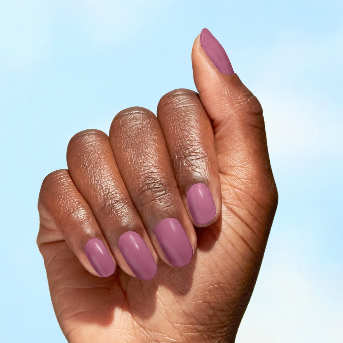 A manicure painted in OPI Simply Radishing