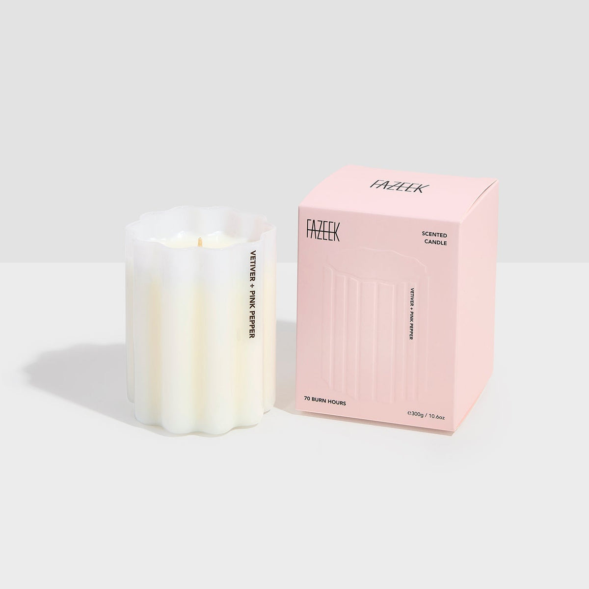 Fazeek Wave Candle in Vetiver and Pink Pepper, rippled white glass with the scent name on the side