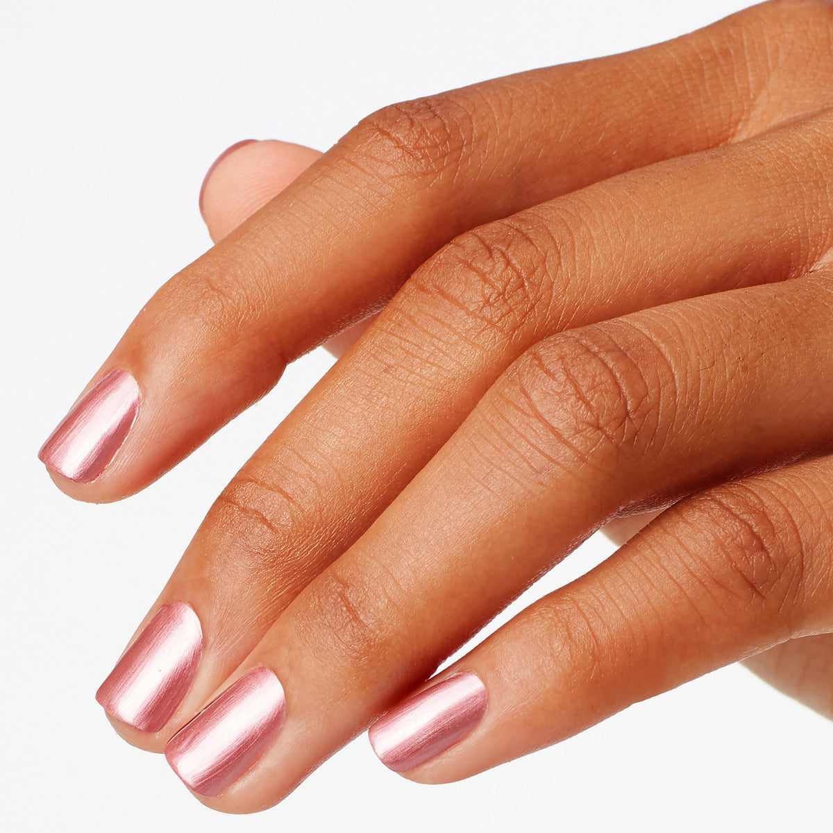 A manicure painted in OPI Chicago Champaign Toast