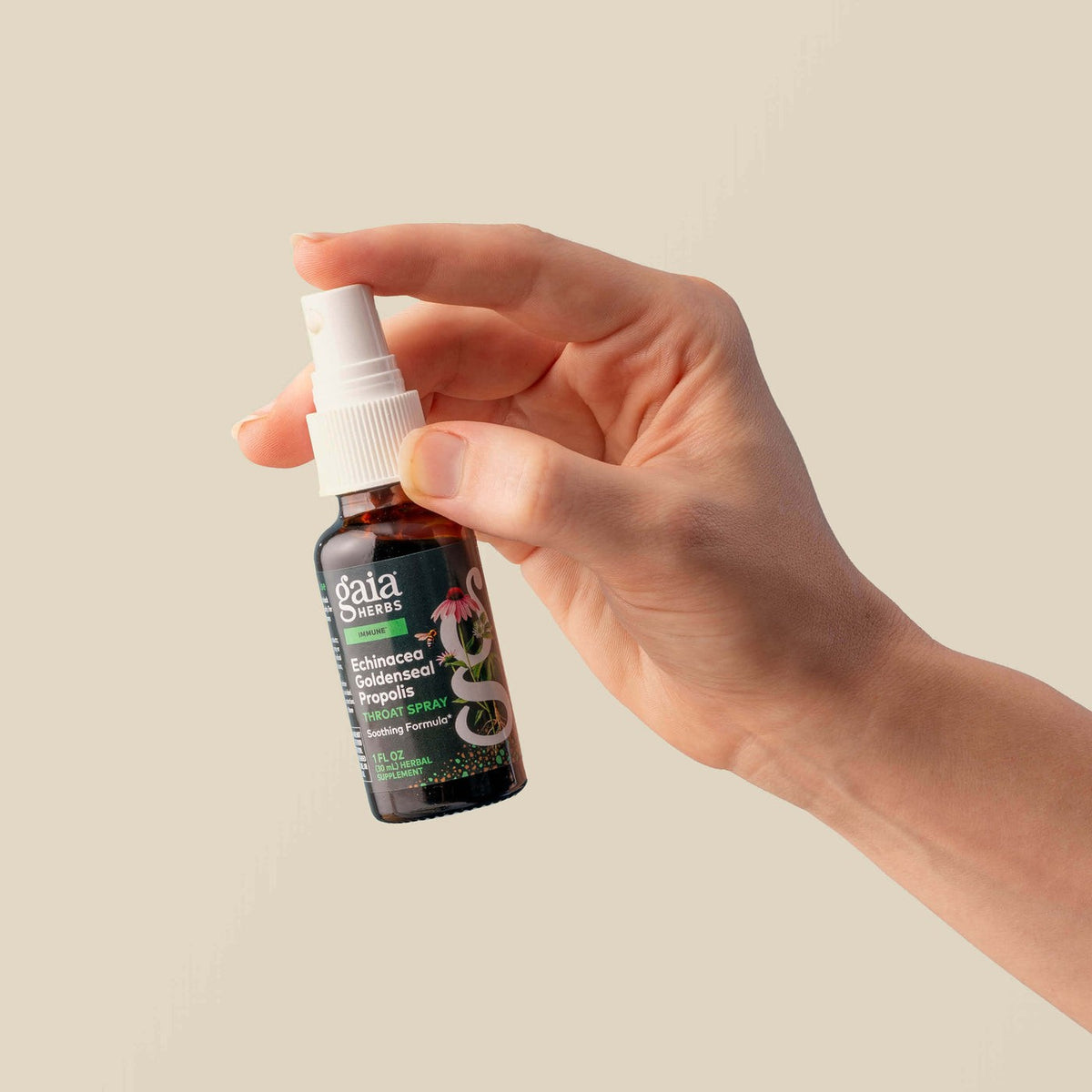 Gaia Herbs Echinacea Goldenseal Propolis Throat Spray held in hand