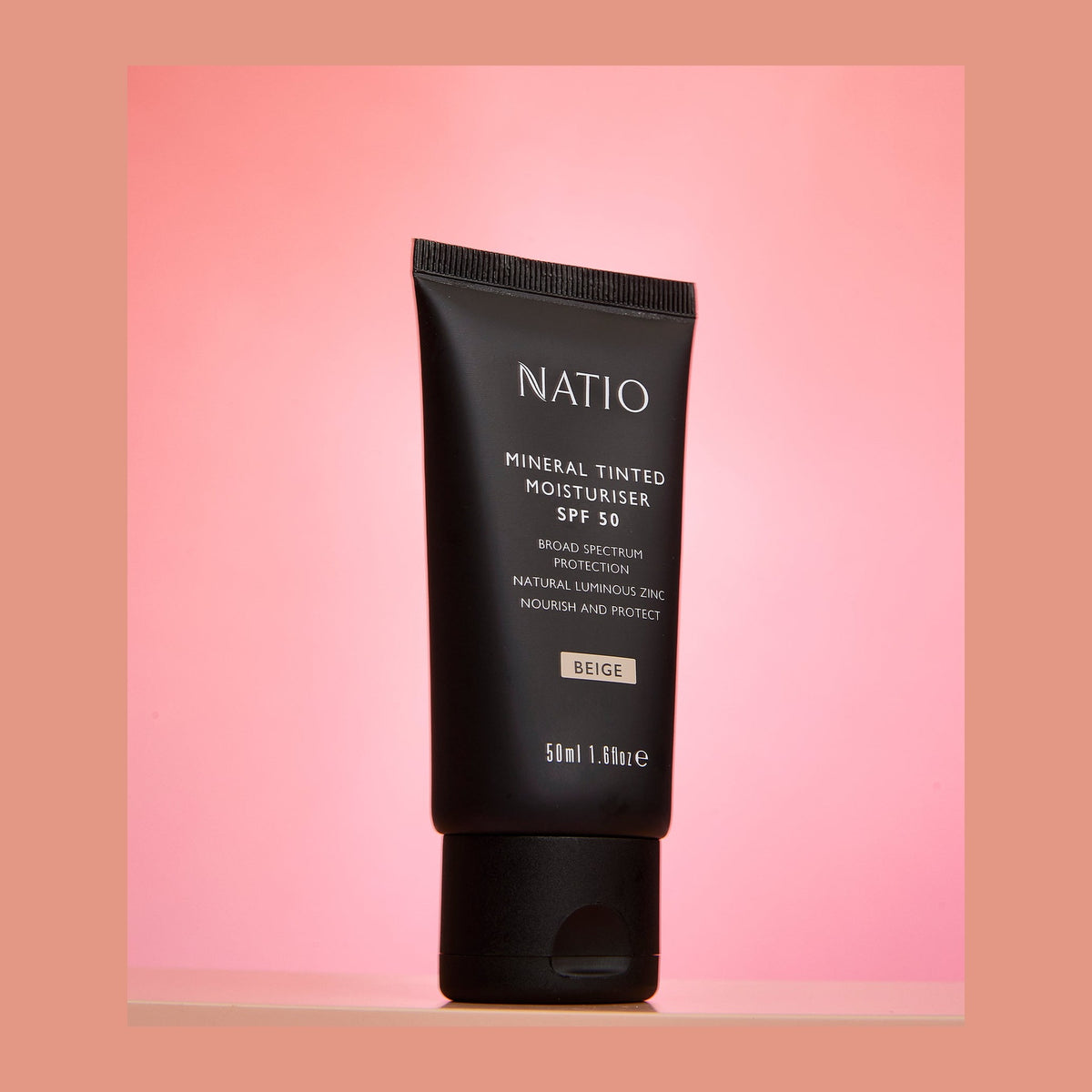 Natio Mineral Tinted Moisturiser SPF50+ Beige styled in a set photograph