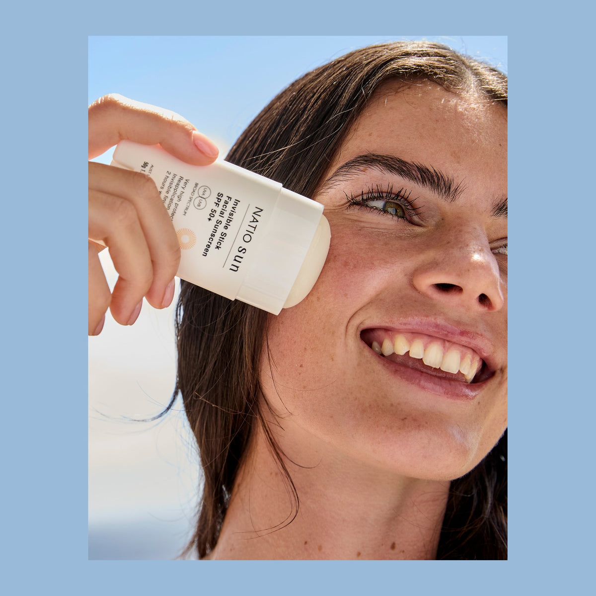 Natio Invisible Stick Face SunScreen SPF50+ 50g shown in use