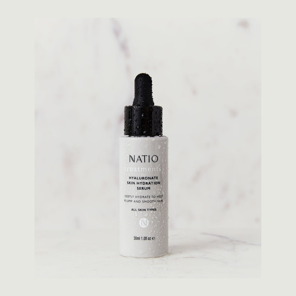 Natio Treatments Hyaluronate Skin Hydration Serum. 30ml styled in a set photograph