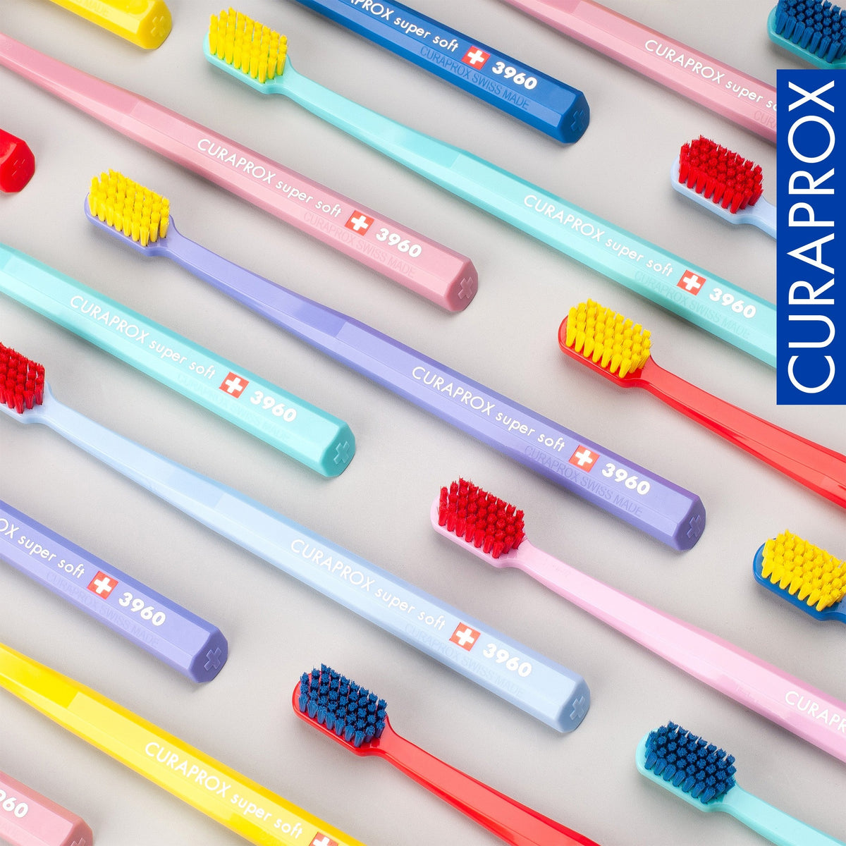 Curaprox CS 3960 toothbrushes laid out in the assorted colour range