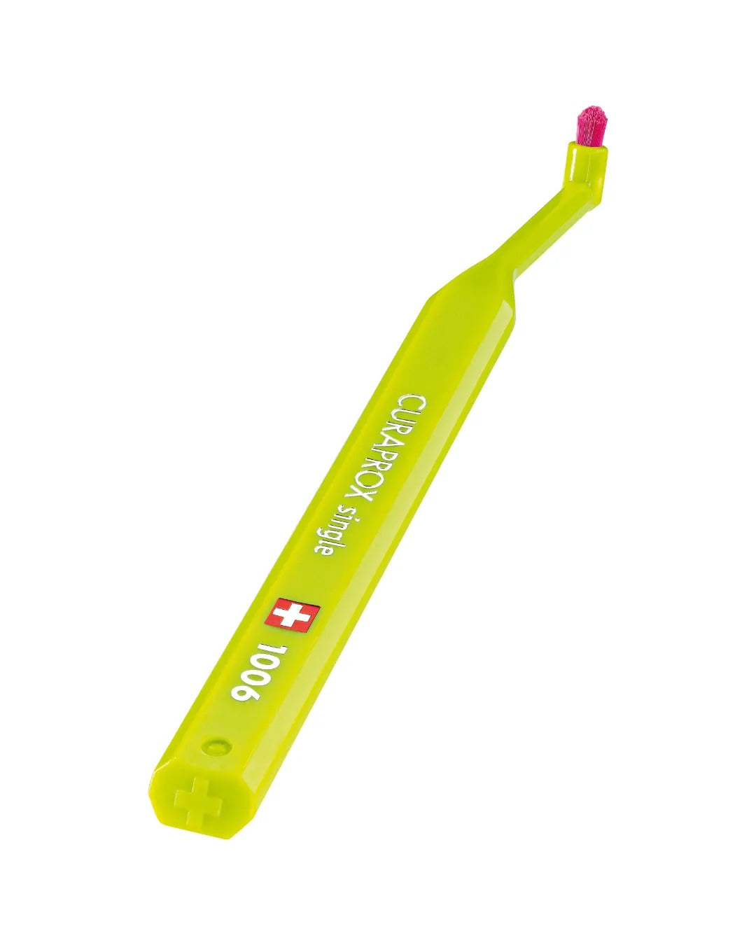 Curaprox CS 1006 single tuft toothbrush on a purple background