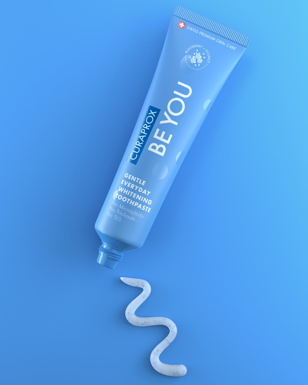 Curaprox Be you Blackberry and Licorice blue tube on a blue background
