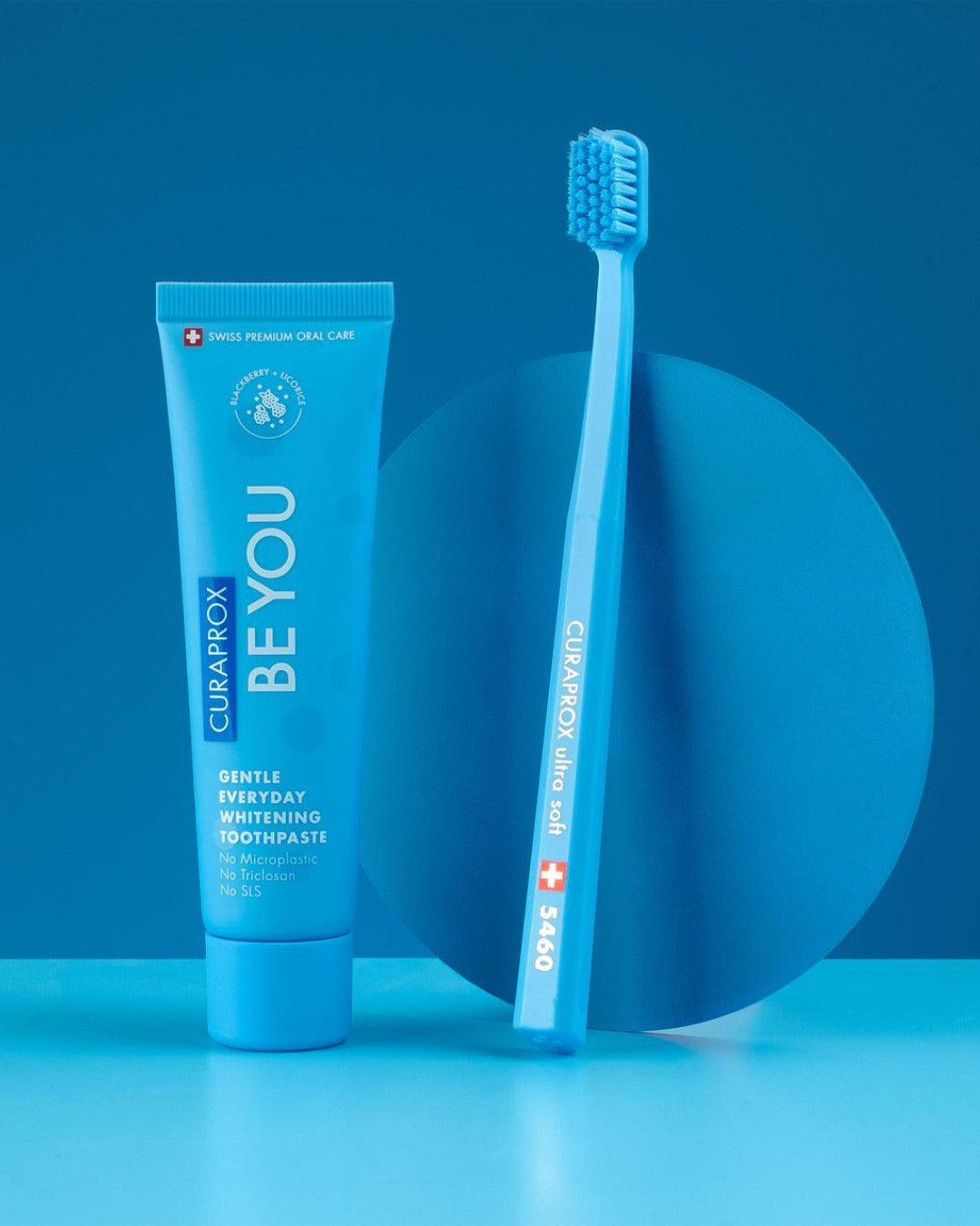 Curaprox Be you Blackberry and Licorice tube with a matching blue toothbrush