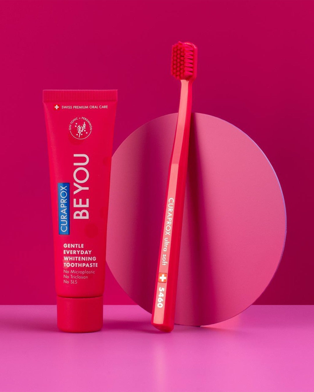 Curaprox Be you Gin Tonic and Persimmon tube with a red toothbrush