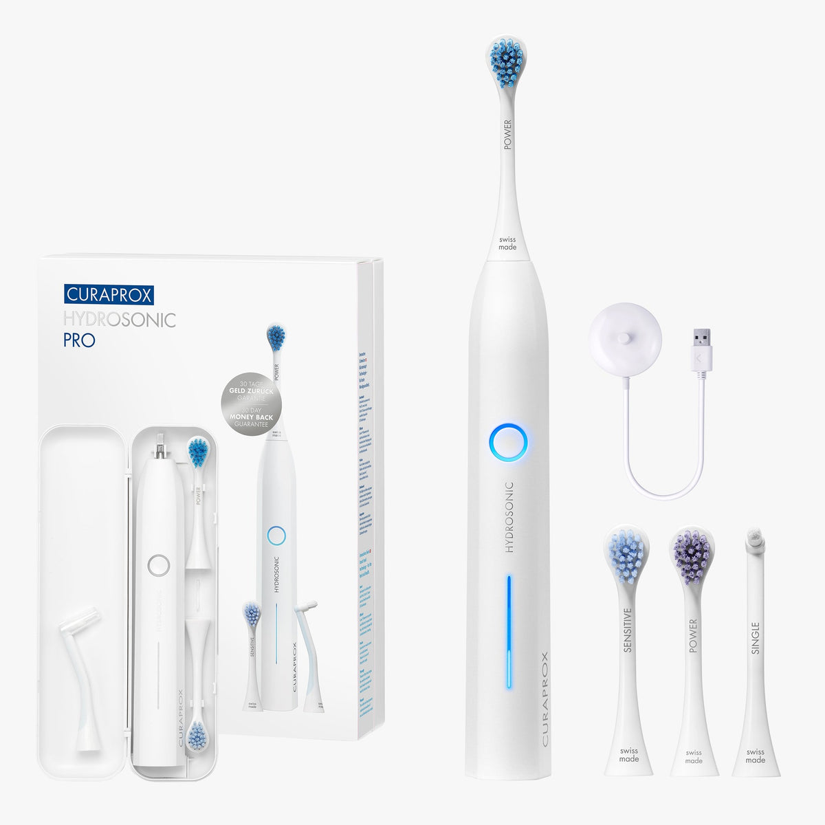 Curaprox Hydrosonic Pro with its three brush heads, charger and travel case