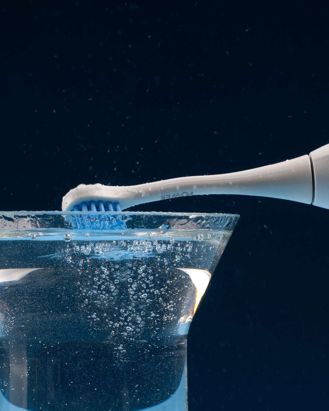 Curaprox Hydrosonic power brush head being dipped in water