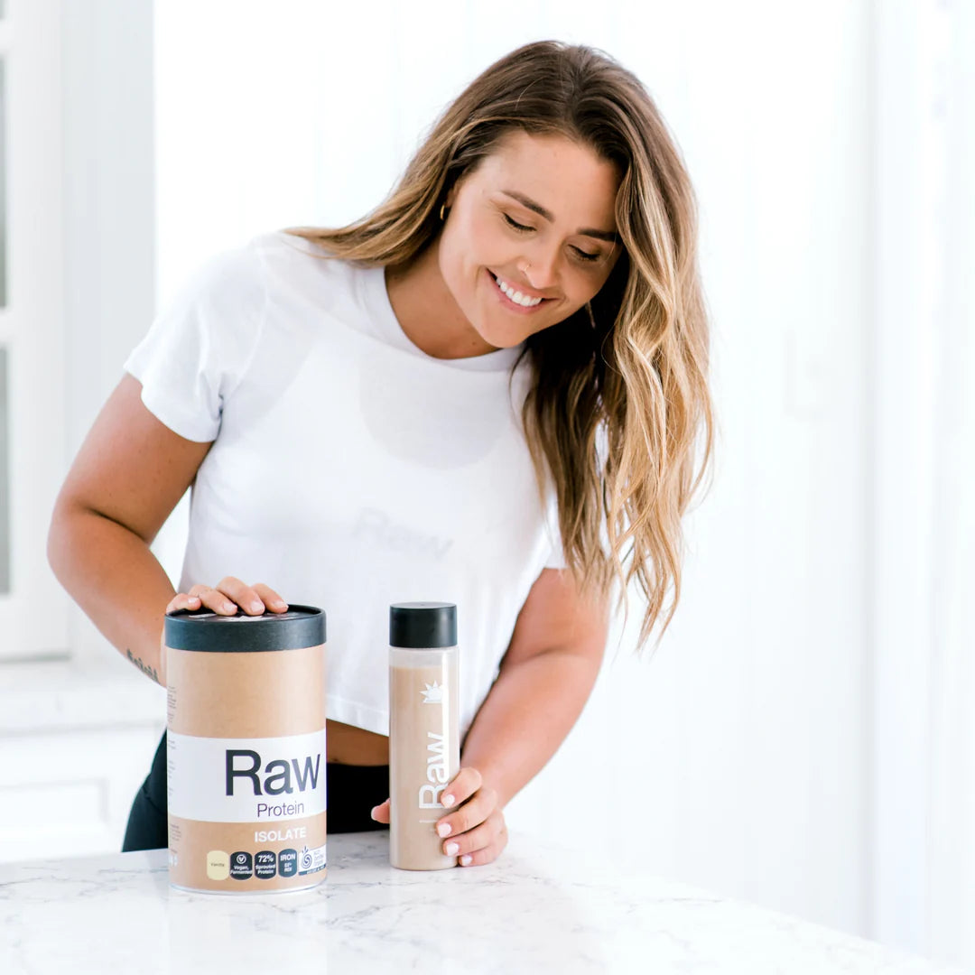 Image of Raw Protein Isolate Vanilla made into smoothie by woman