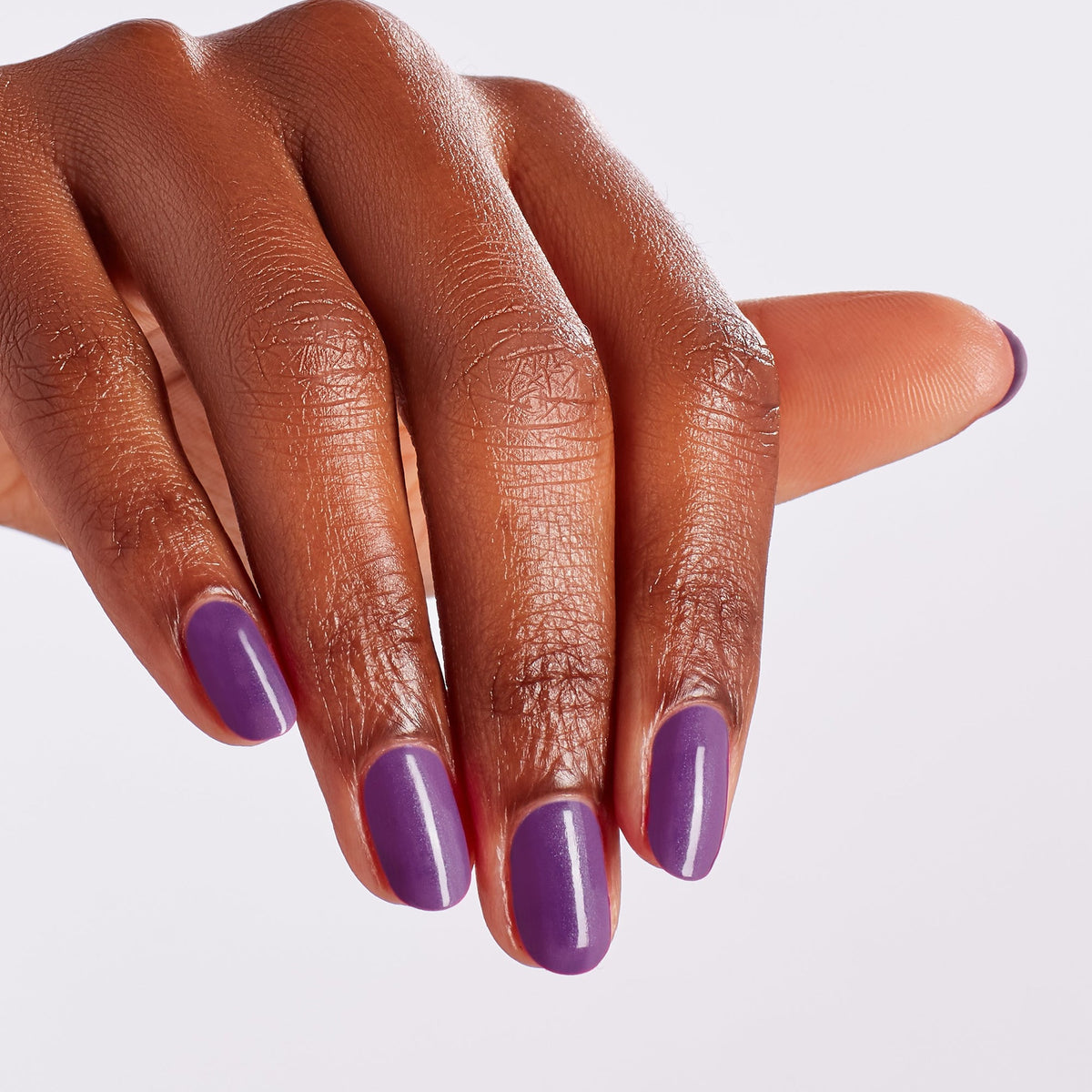A manicure painted in OPI Medi-take It All In