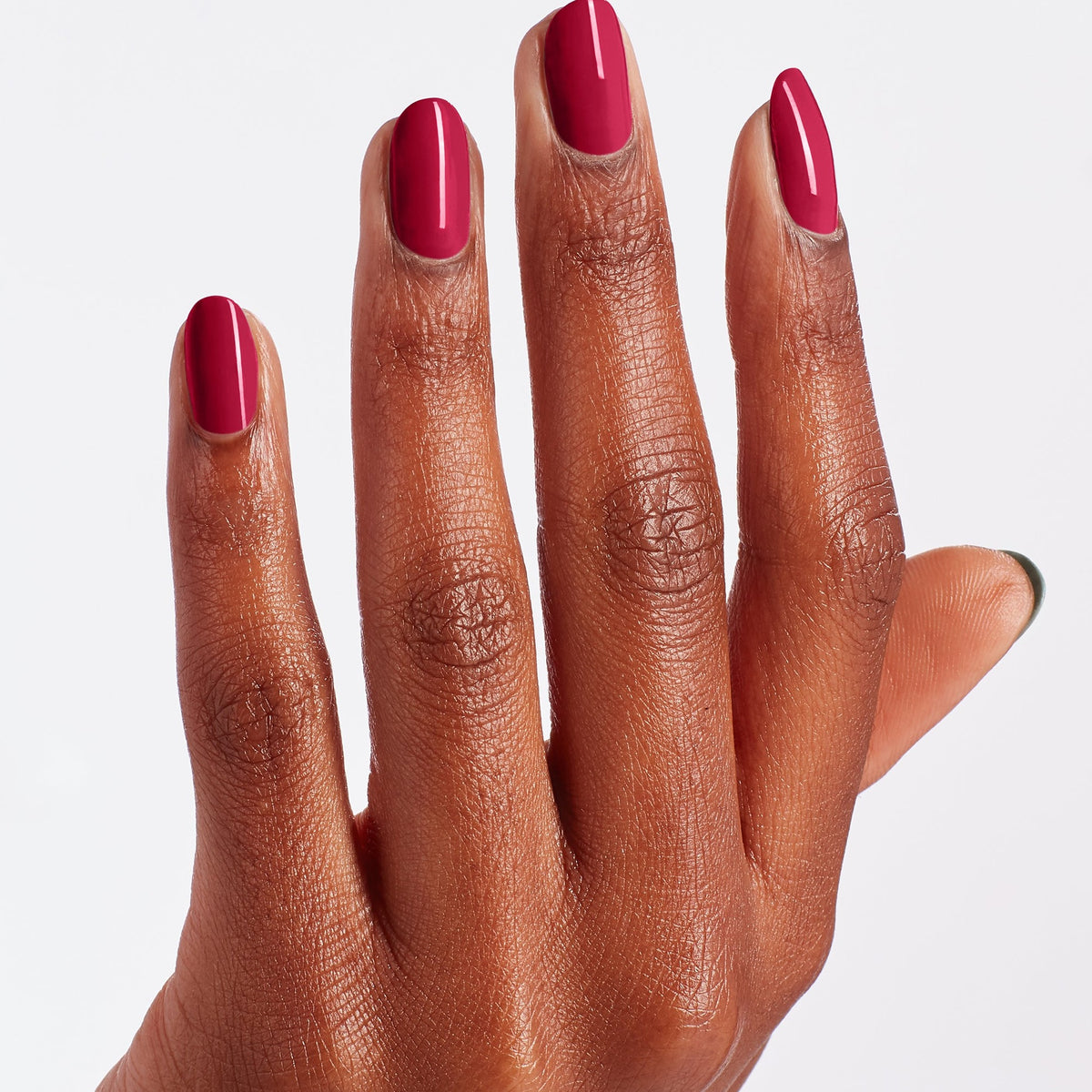 A manicure painted in OPI Red-Veal Your Truth