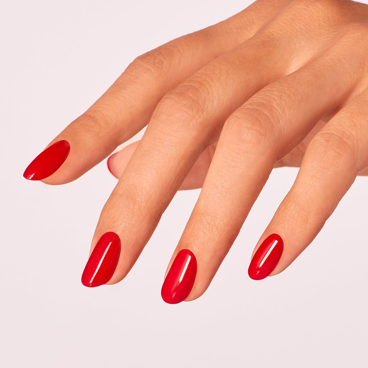 A manicure painted in OPI Red Heads Ahead