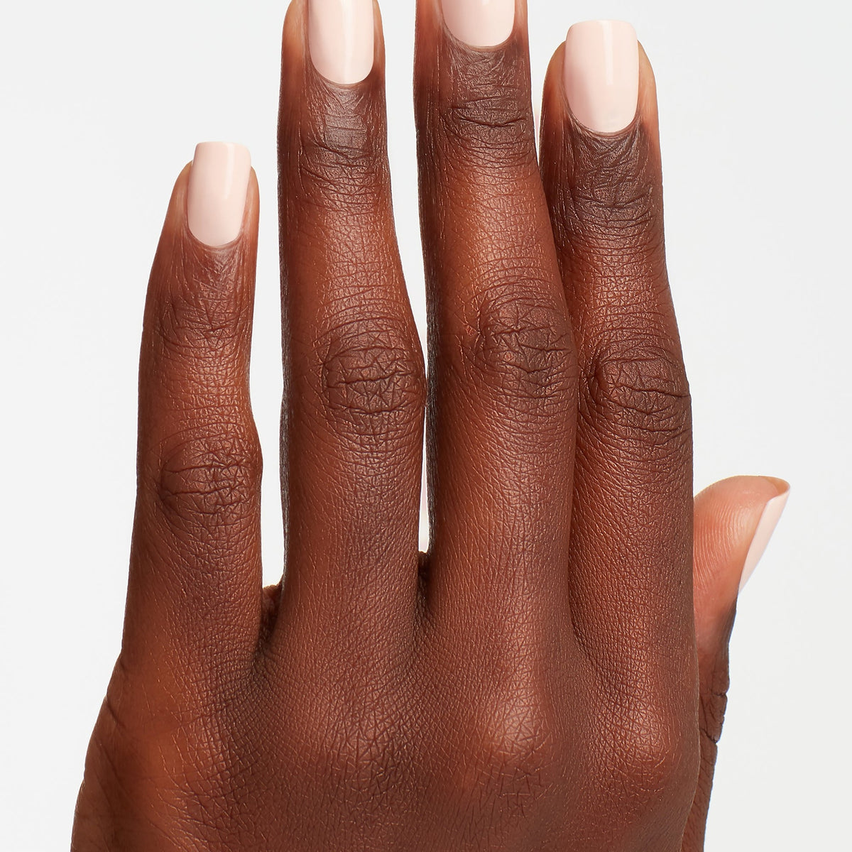 A manicure painted in OPI Stop It I'm Blushing!