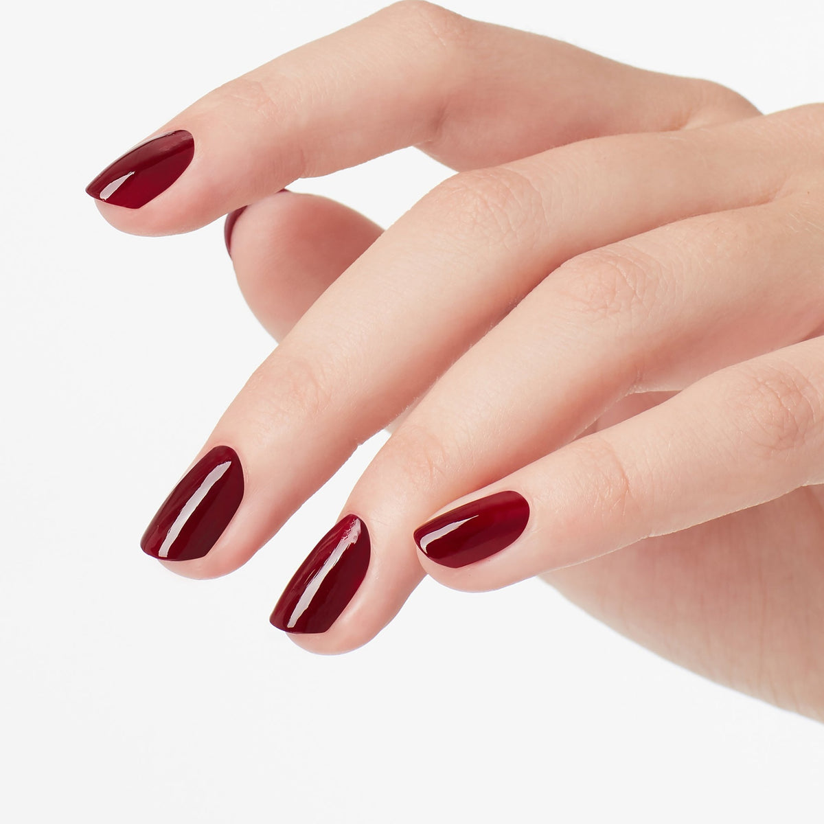 A manicure painted in OPI Got the Blues for Red