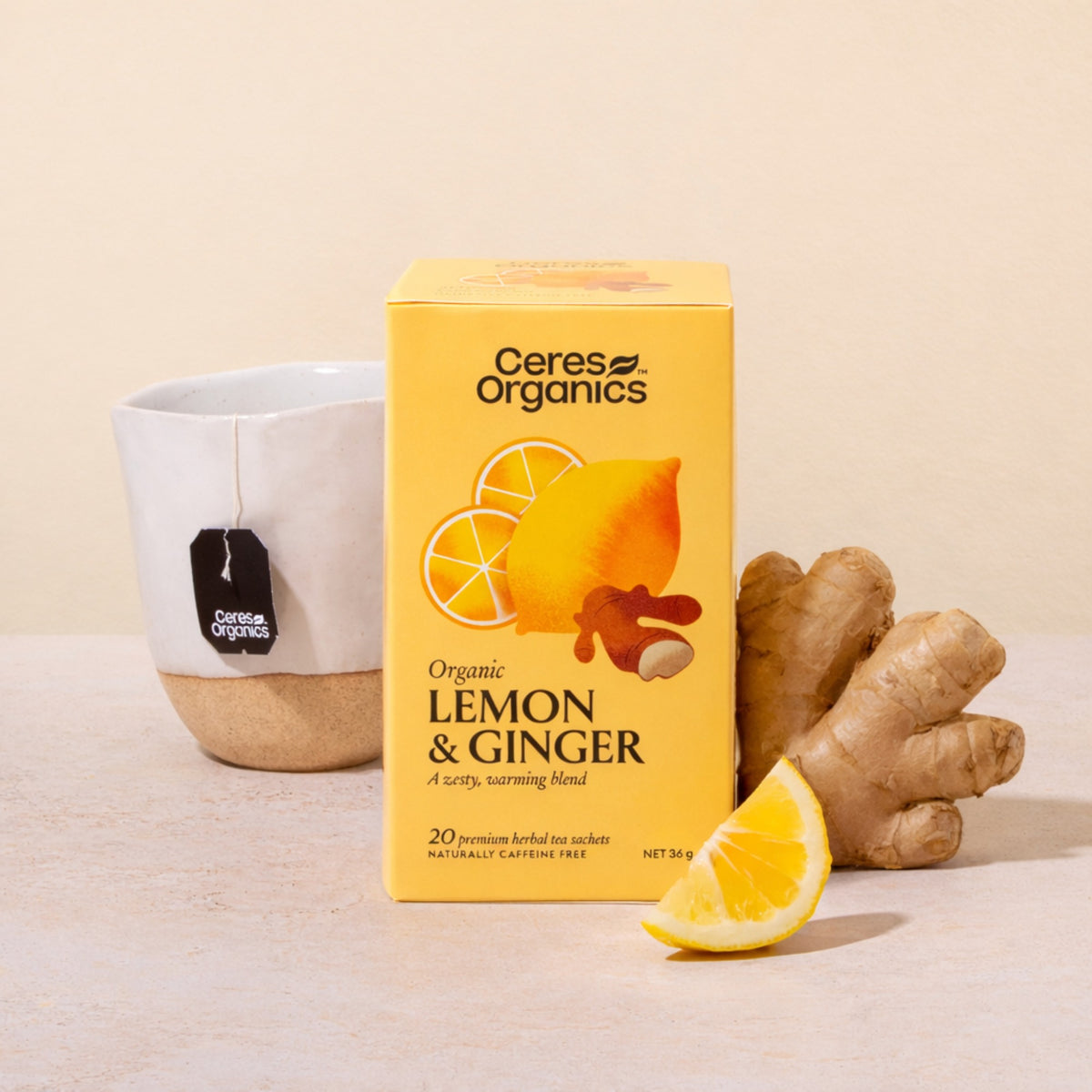 Ceres Organics Lemon & Ginger Herbal Tea box with fresh ginger and lemon