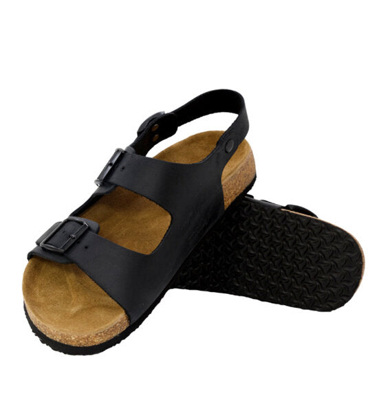 Black sandal with cork sole on a white background