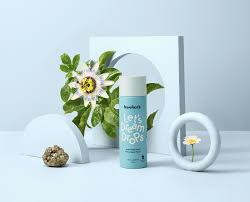 Image of the product placed nicely on a table with some flowers around it. 