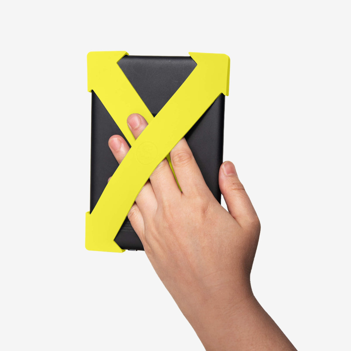 Strapsicle Kindle straps in Neon Lemon fitted to an e-reader and held in one hand