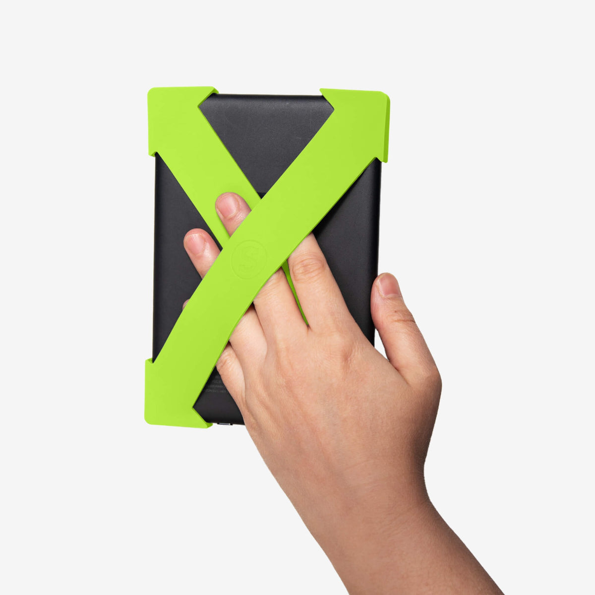 Strapsicle Kindle straps in Neon Zest fitted to an e-reader and held in one hand