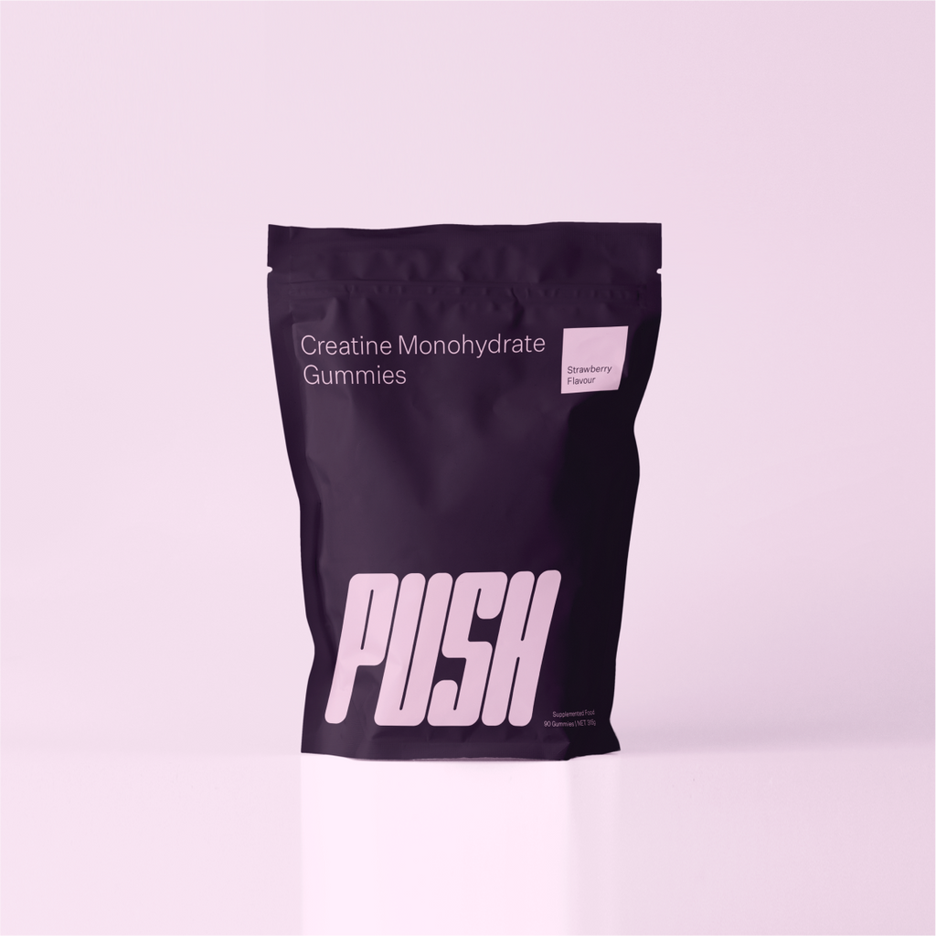 Image of PUSH Creatine Monohydrate Strawberry 90 Gummies against a pink backdrop