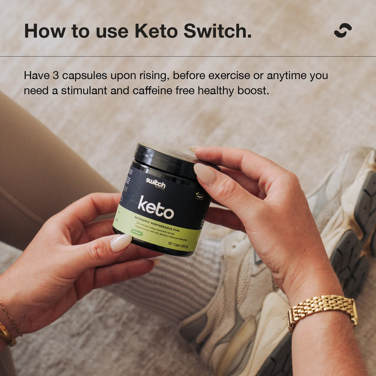 Hand holding the Switch Nutrition Keto BHB 90 capsule tub, with directions to take 3 capsules on rising or before exercise