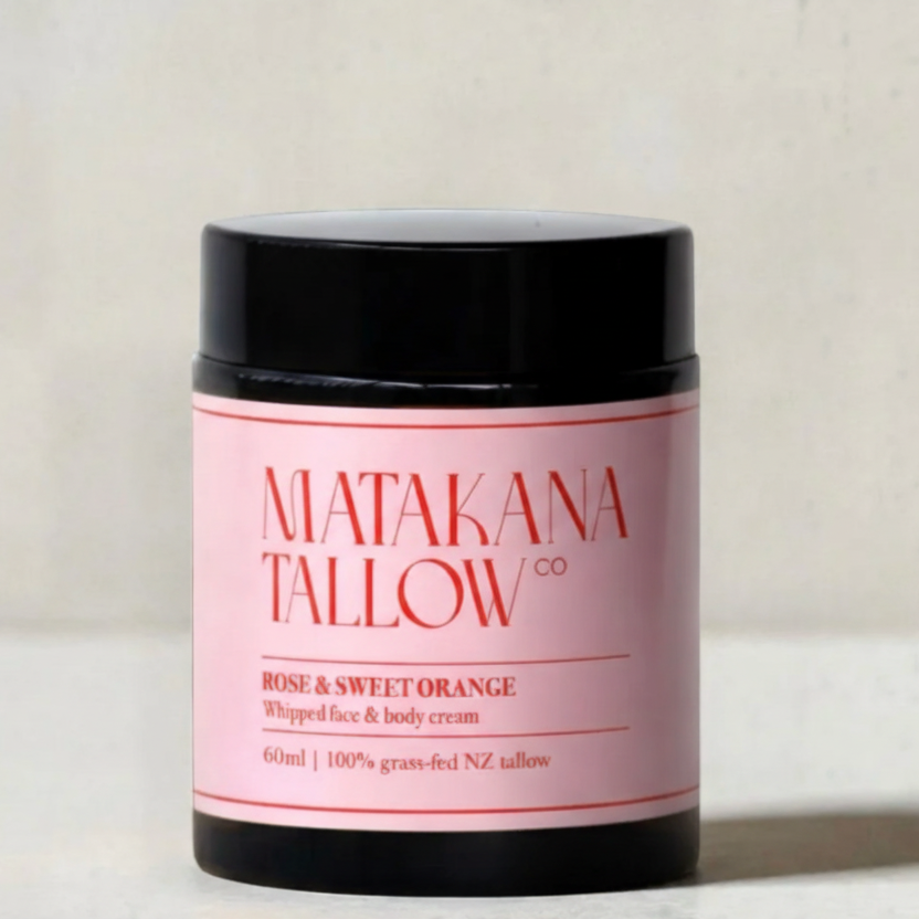 Jar of Matakana Tallow cream with pink label on a light background