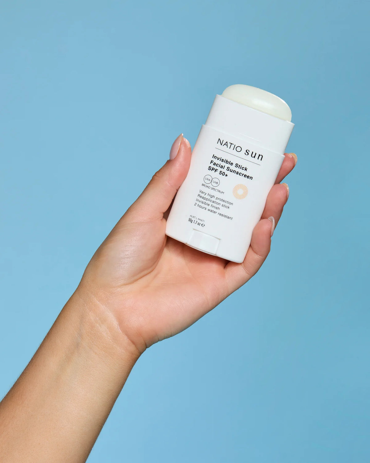 Image of person holding Invisible Stick Face SunScreen SPF50+ 50g