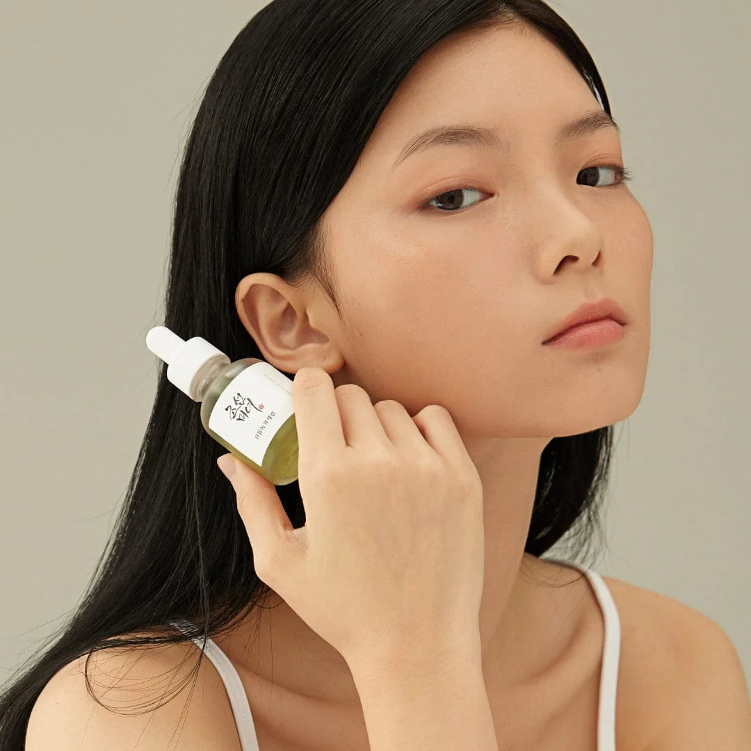 Image of woman holding Calming Serum: Green Tea + Panthenol 30ml