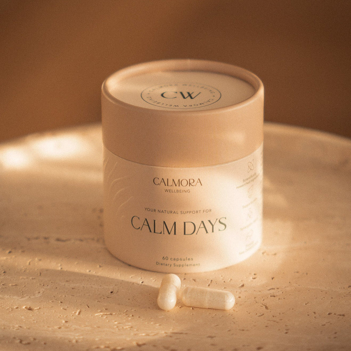 Calmora Wellbeing Calm Days 60 capsule tub with two capsules beside it