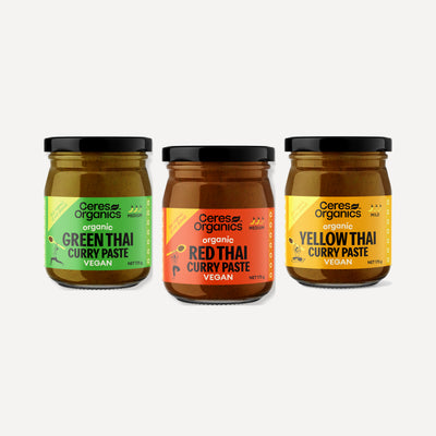Three jars of Ceres Organics Thai curry paste side by side, green, red and yellow, 175g each