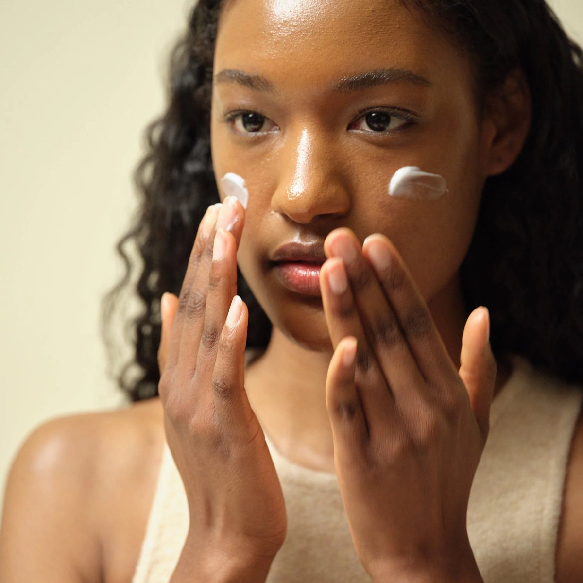 Image of woman applying Dynasty Cream 