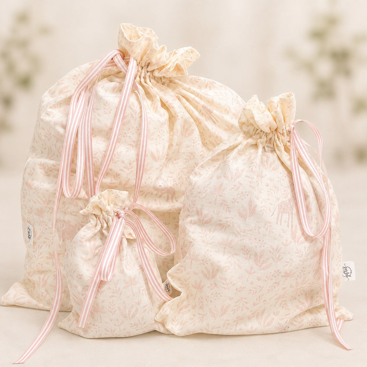Baby Girl handmade fabric gift bag by Gifted With Love, shown in all three sizes