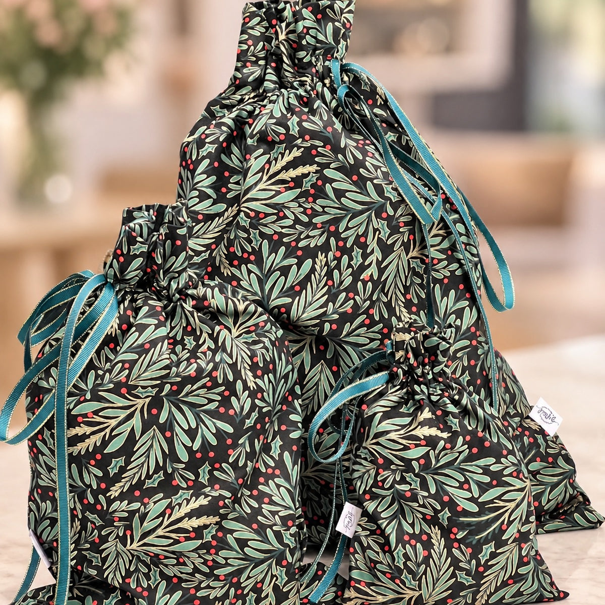 Green, Red and Gold Foliage handmade fabric gift bag by Gifted With Love, shown in all three sizes