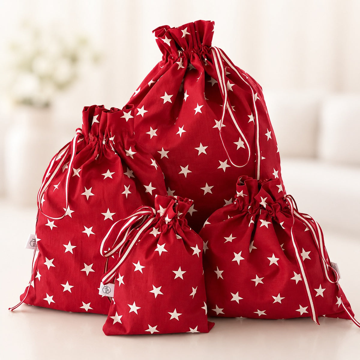 Red Star handmade fabric gift bag by Gifted With Love, shown in all three sizes