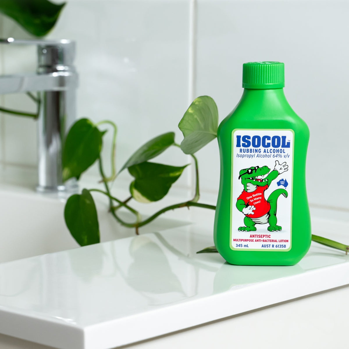 Isocol Rubbing Alcohol Antiseptic Lotion 345ml bottle on a white bathroom basin