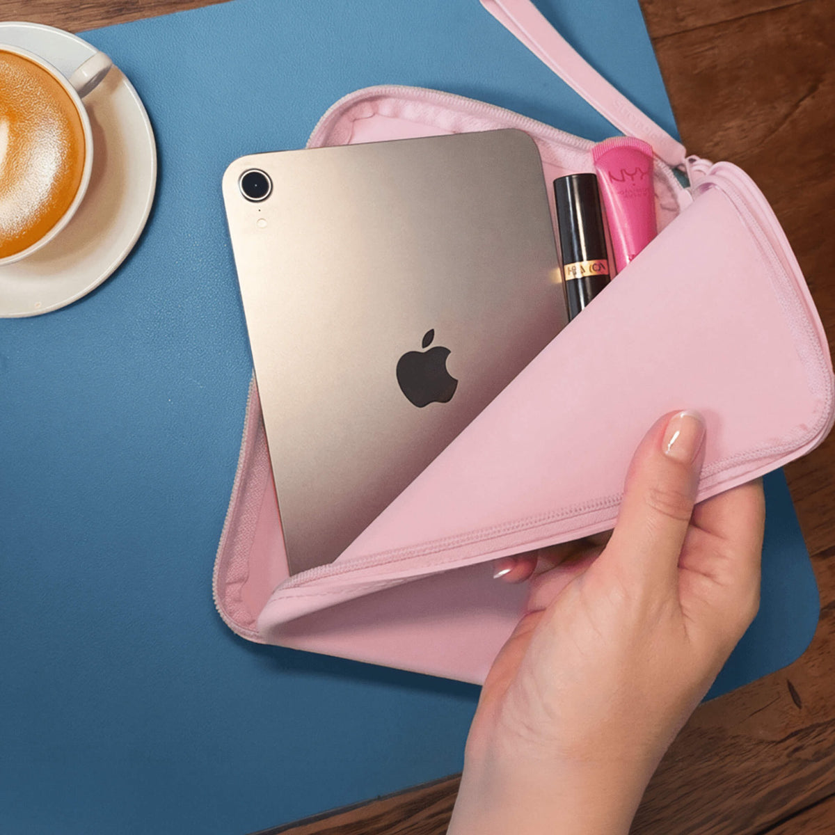 The Strapsicle Clutch in Blush in use