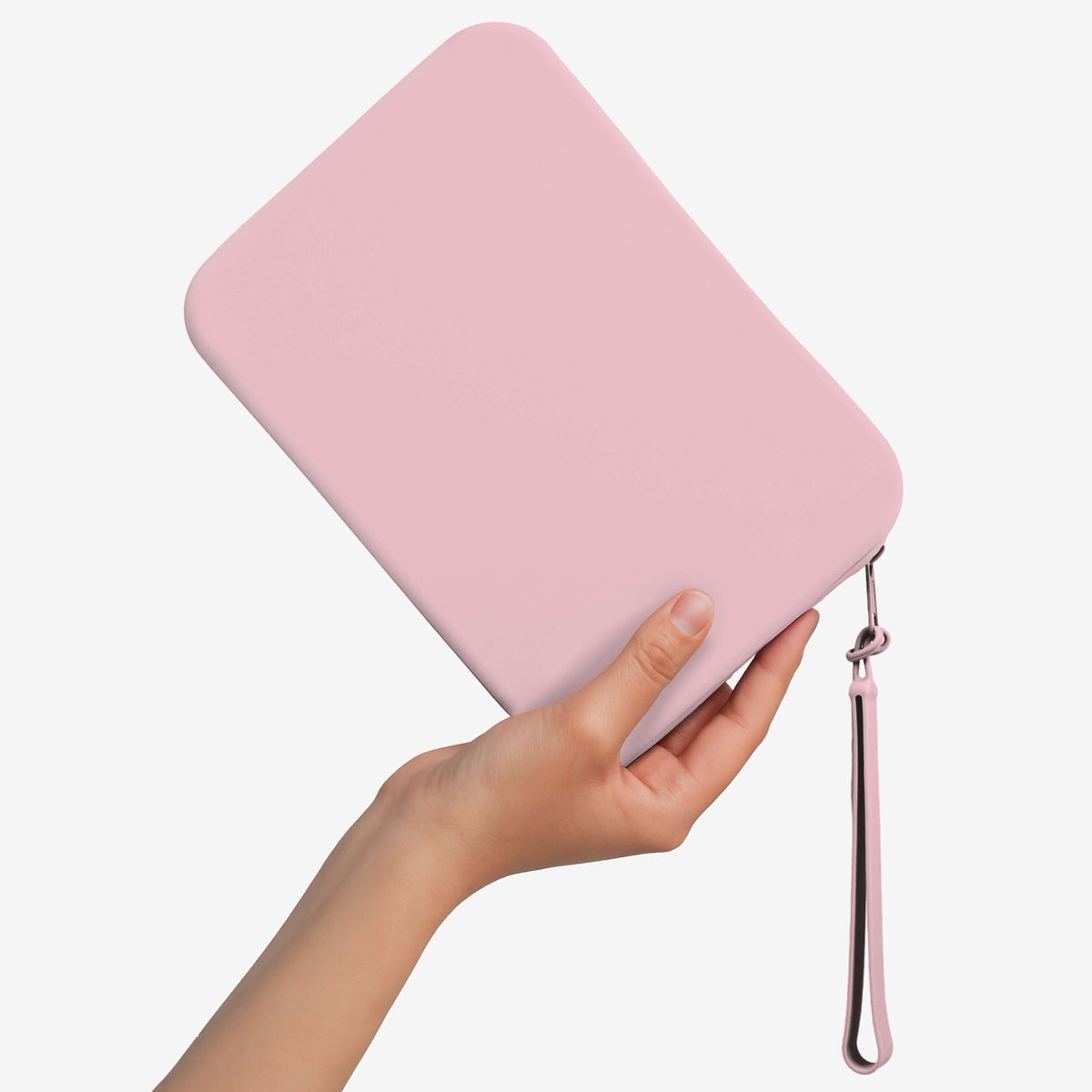 The Strapsicle Clutch in Blush, a second view in the hand