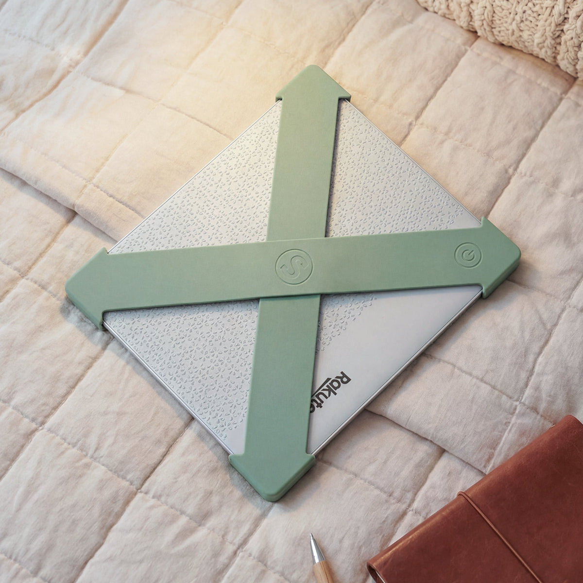 The Strapsicle Clutch in Sage in use