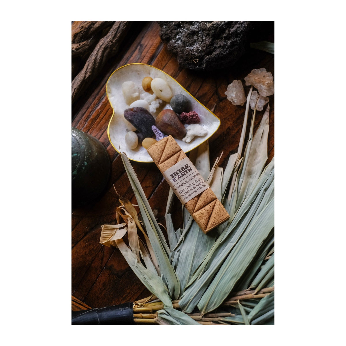 Giving Tree Incense Planks - Sandalwood & Red Cedar incense burning, with the botanicals it is made from