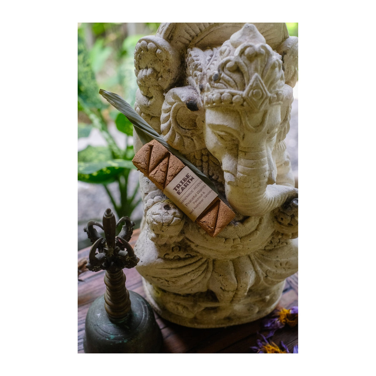 Peaceful Warrior Incense Planks - Sandalwood & Patchouli incense burning, with the botanicals it is made from