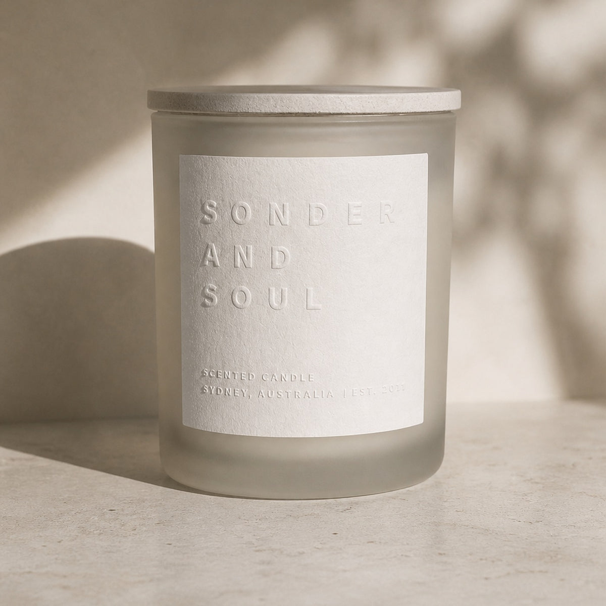 Coconut and Lemongrass soy candle, frosted glass jar with the embossed Sonder and Soul label
